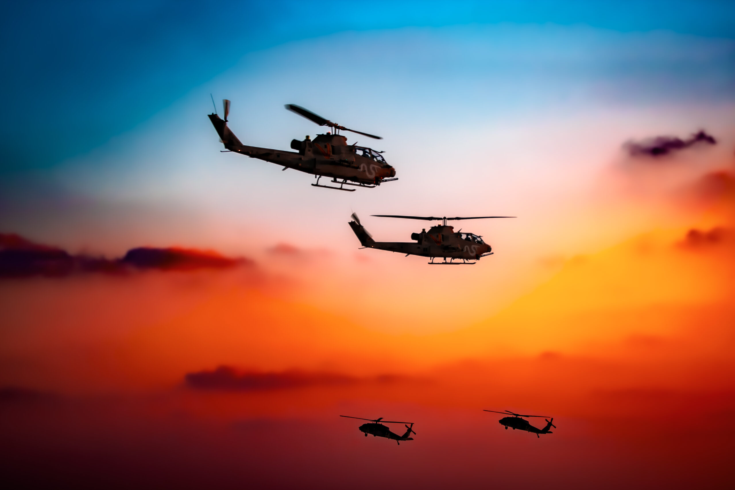 Israeli Air Force AH-1 Cobra and UH-60 Black Hawk flight at twilight