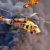 AN IAF UH-60 Black Hawk "Yanshuf" (owl) passing by an AH-1 Cobra "Tzefa" (Viper)